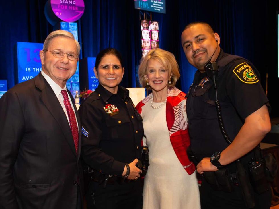 Mike and Marla Boone with Deputy Constable Bertha Rivera Roop, Deputy Sheriff Jos\u00e9 Sorola