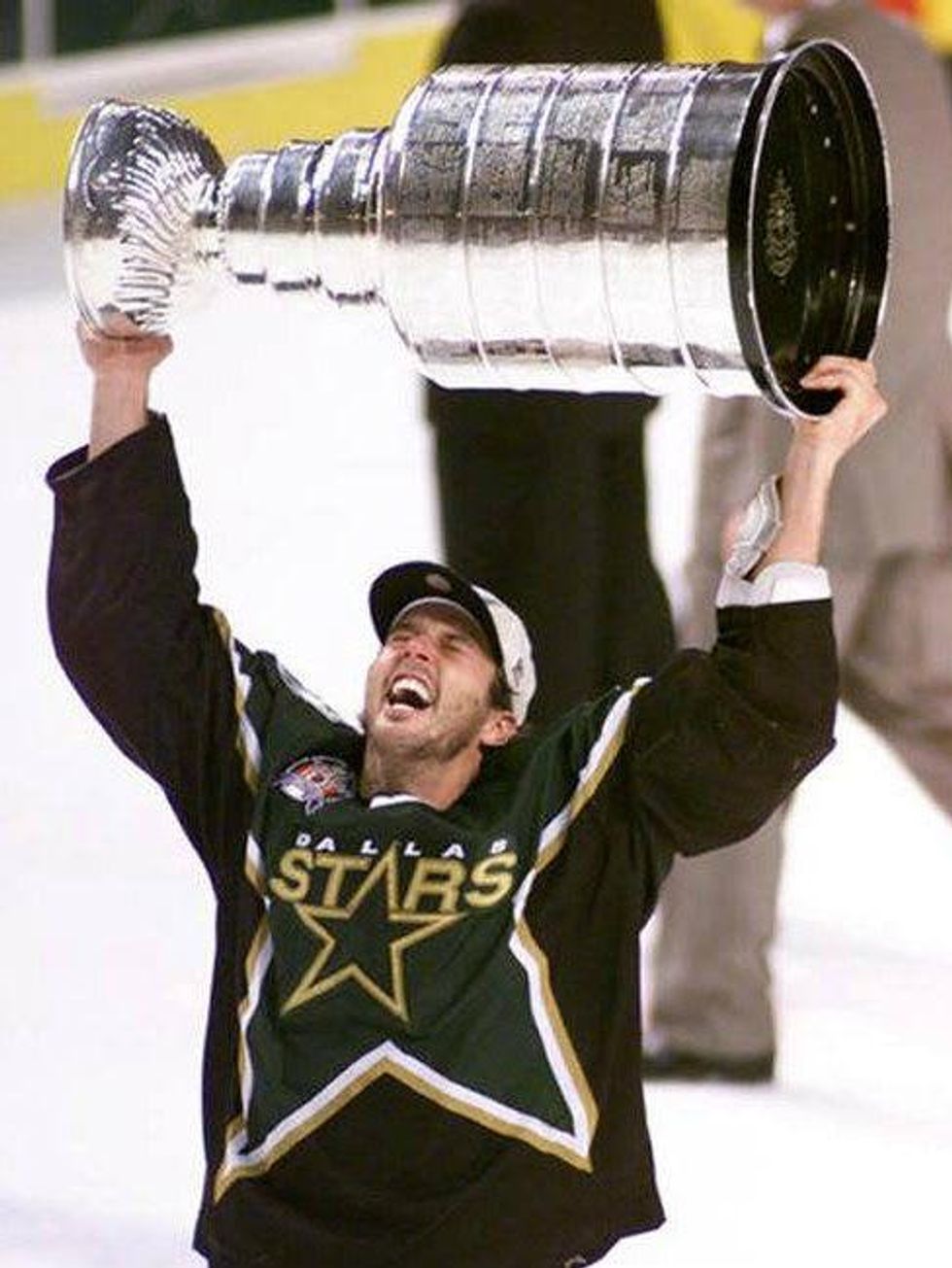 Mike Modano holding Stanley Cup