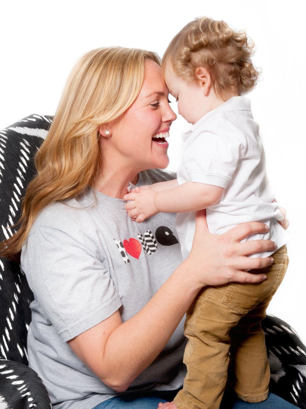 Mom wearing Tumtee t-shirt with baby