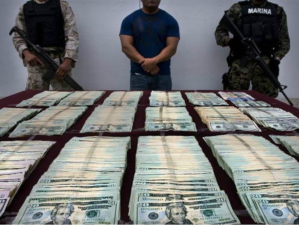 Money and guns seized from Mexican drug cartel
