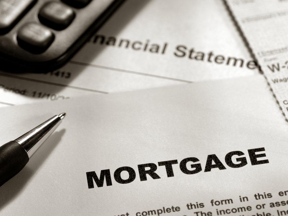 mortgage rates with pen and calculator