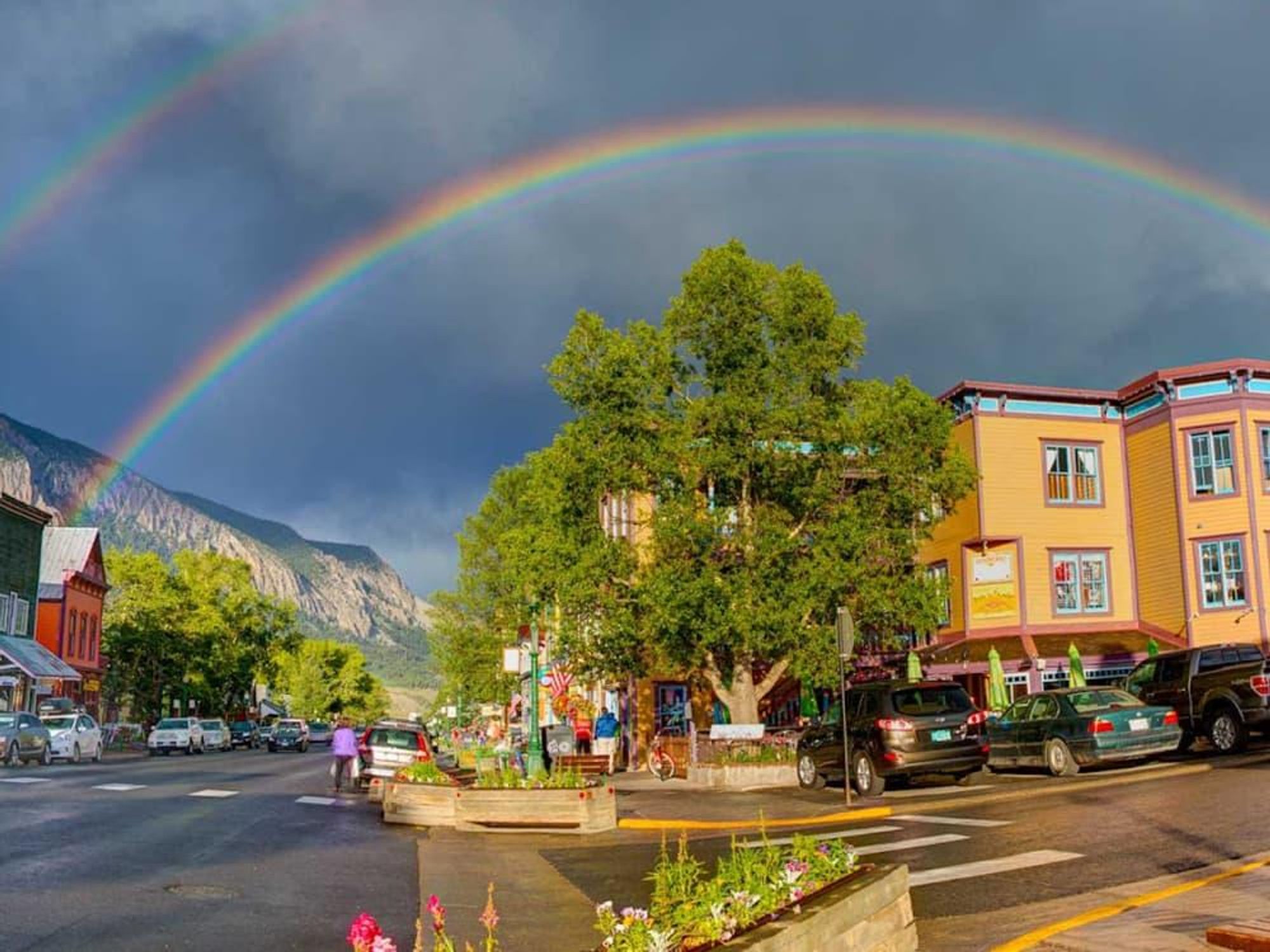 Mount Crested Butte Colorado rainbow over city
