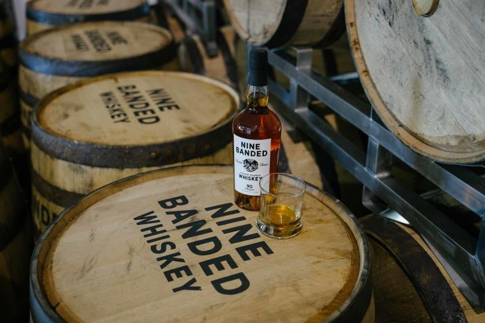 Nine Banded Whiskey on barrels