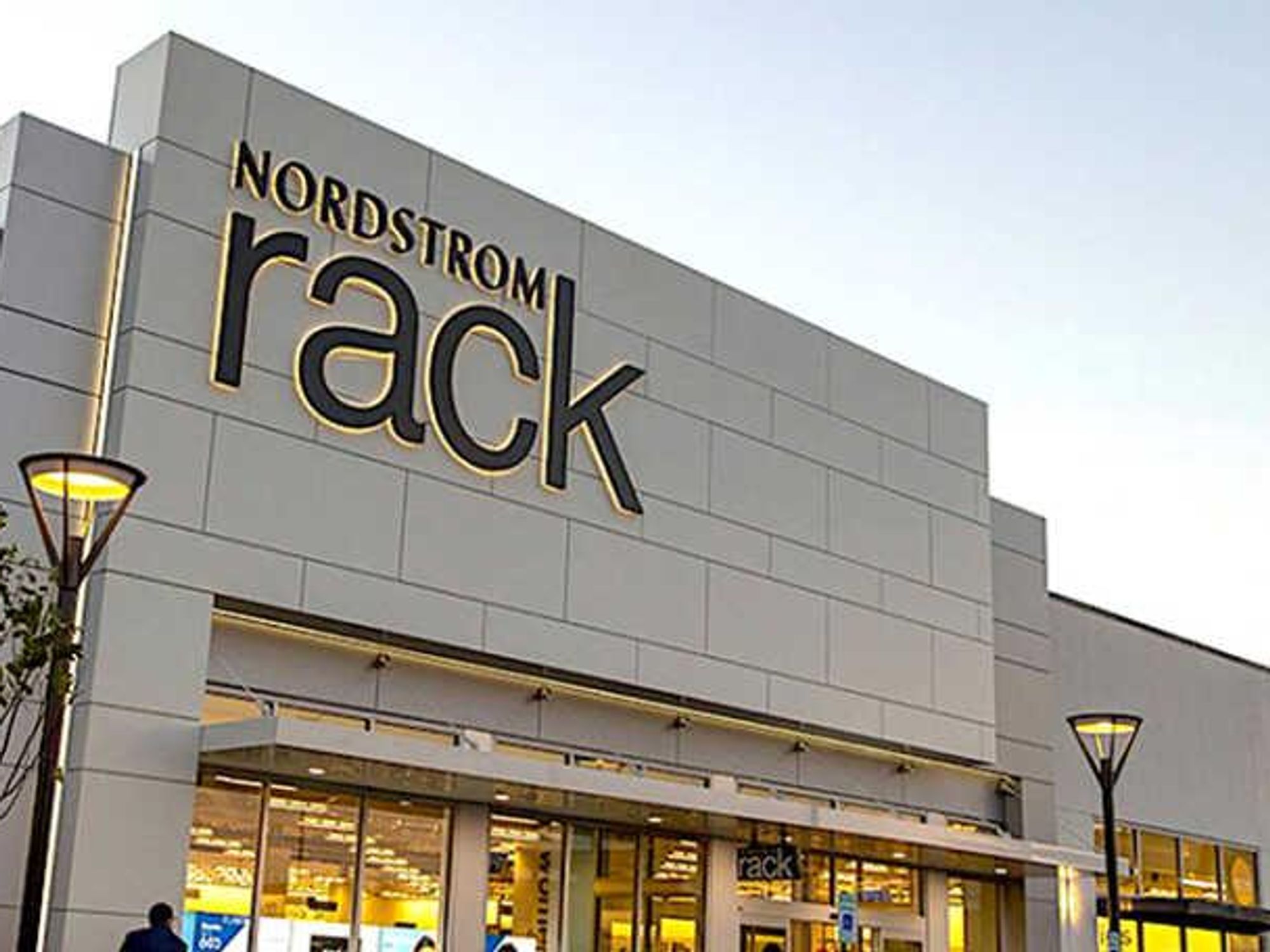 Men's clothing is displayed for sale inside a Nordstrom Rack store