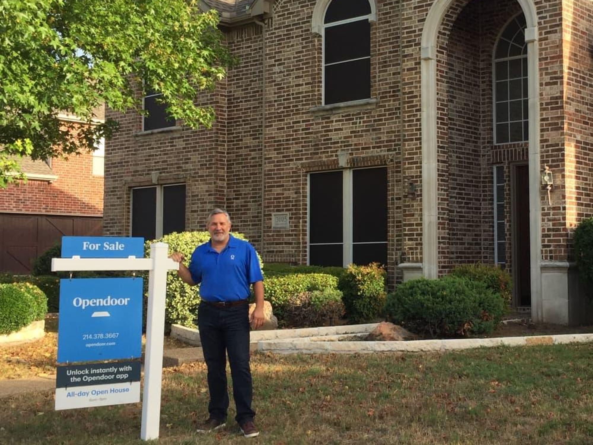 Opendoor employee Tony Hughes in front of a house