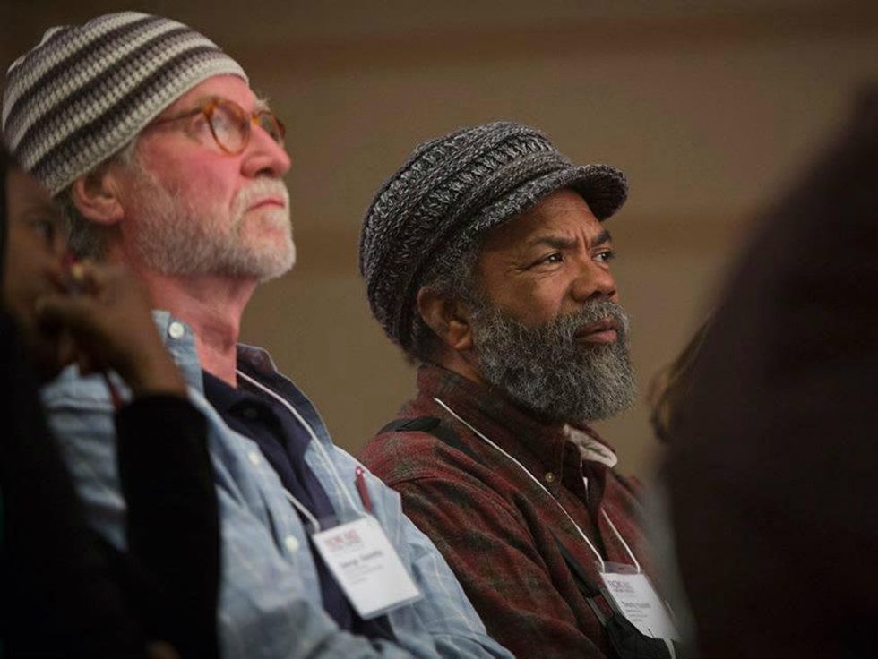 Participants listen to panel at the Face Race conference