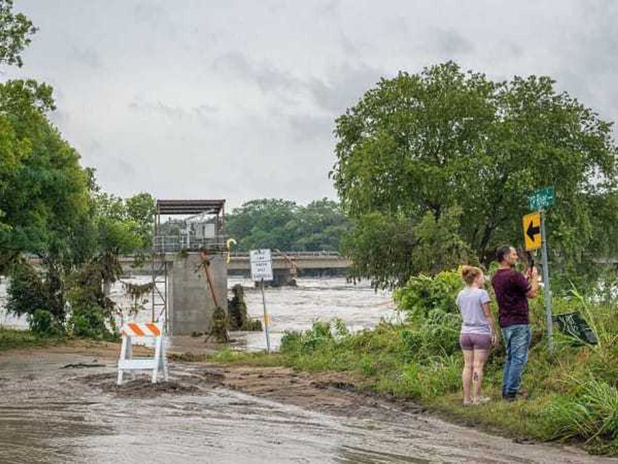 People look out at flood on July 16, 2026 in Center Point, Texas