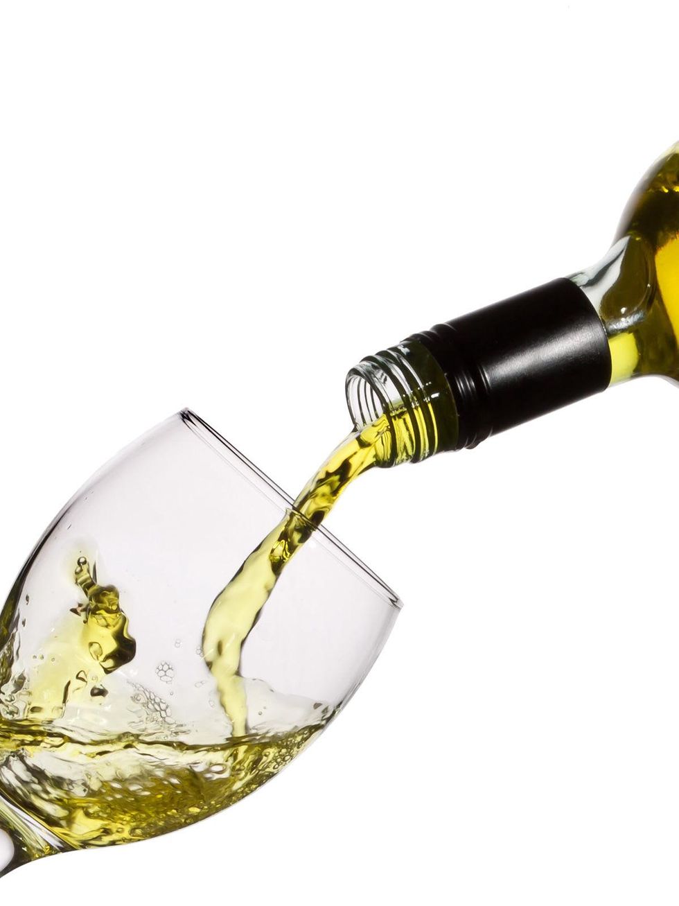pouring white wine into a glass