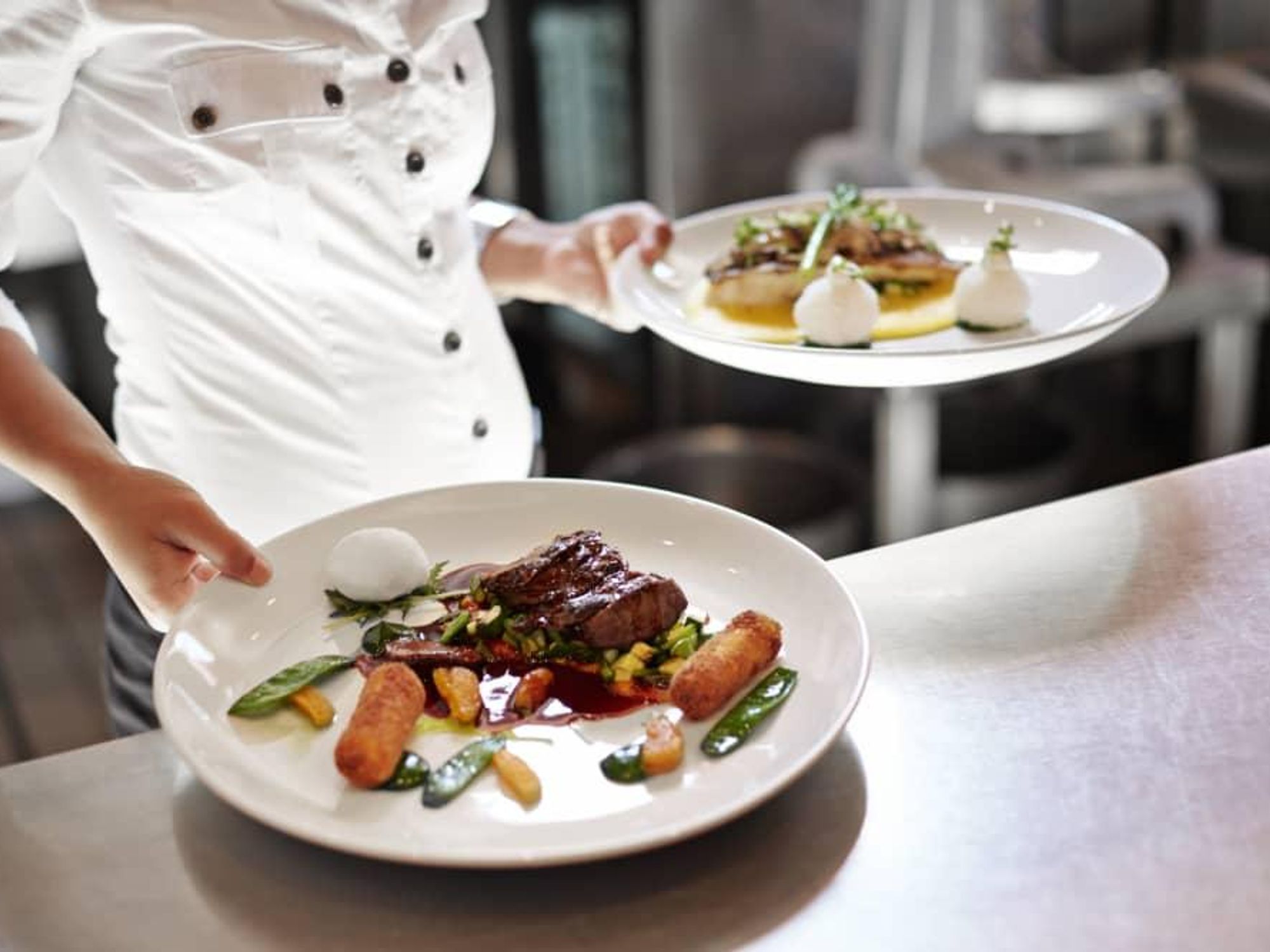 restaurant kitchen server with dishes of food