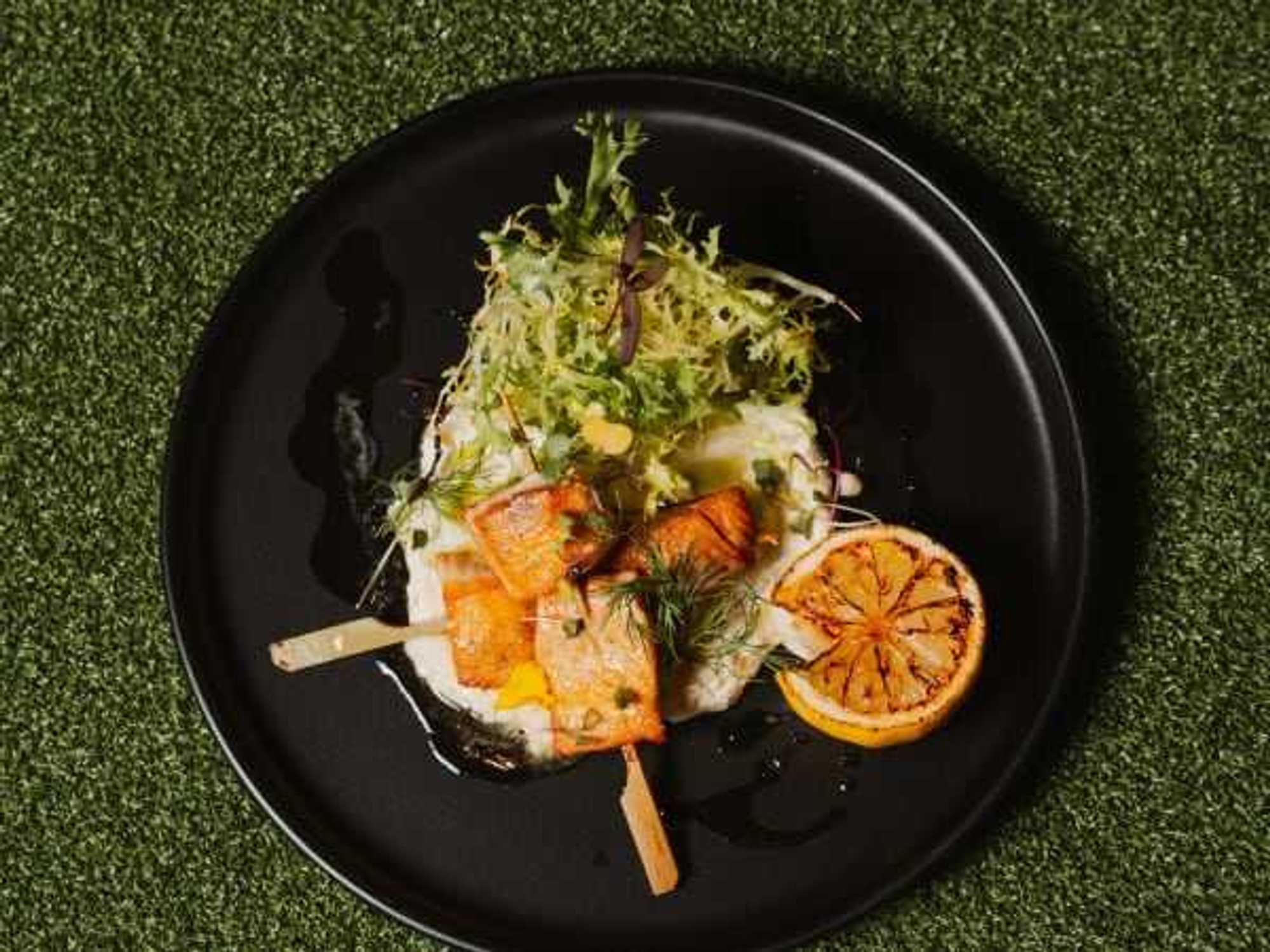 Saffron salmon skewers, one of the featured seafood offerings on Chef Madan Oli’s menu at Sip’Stroke.