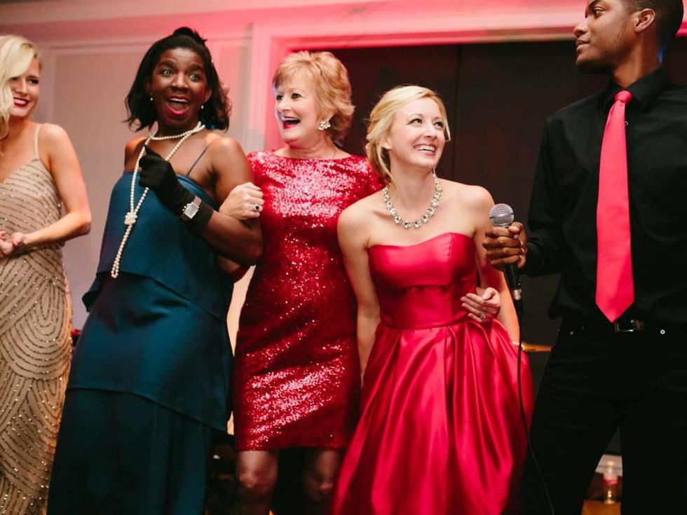 Sarah Frances Mickle, Sheri Eudaly, and Kailey Posey dance with Signature Band