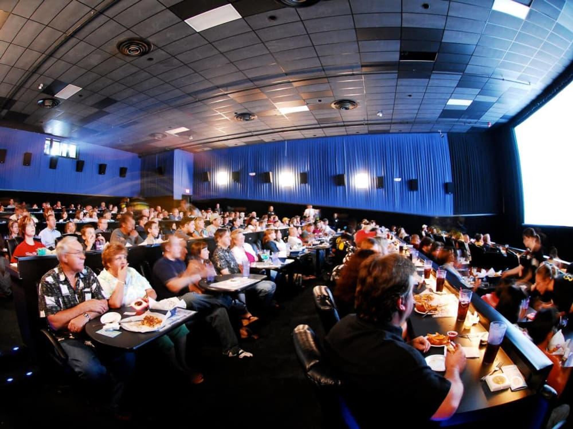 Studio Movie Grill, theater, crowd, watching a movie