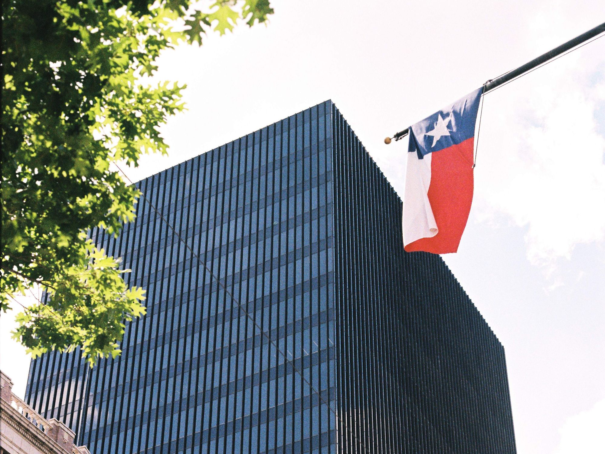 Texas flag over office building