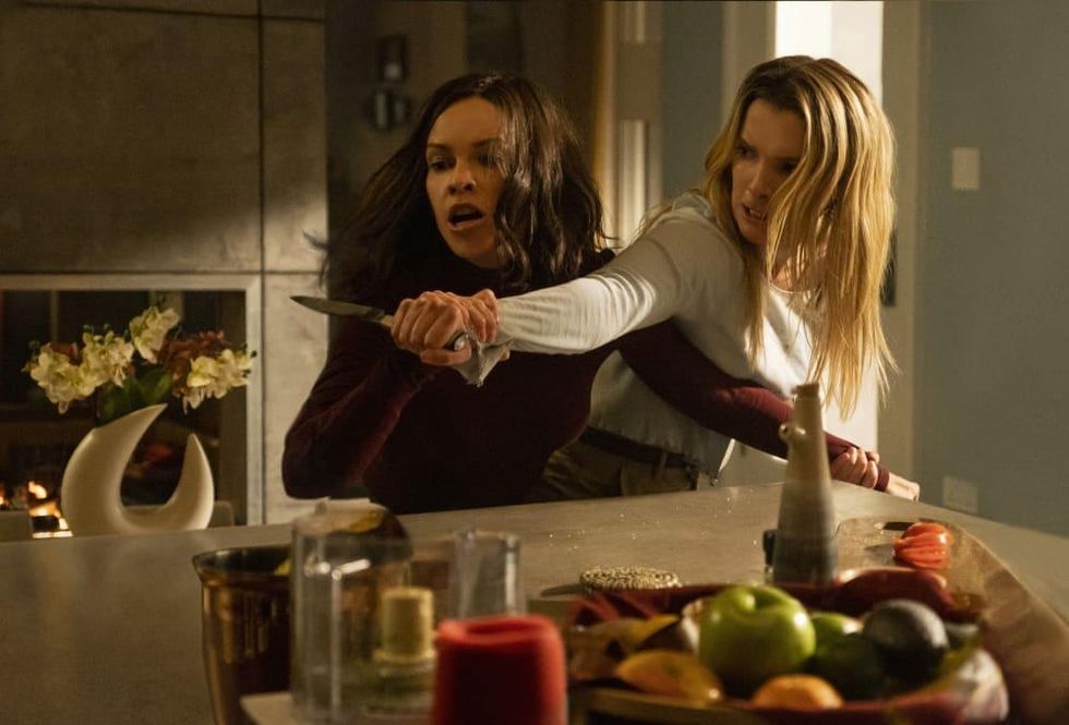 The Hunt movie review Athena (Hilary Swank) and Crystal (Betty Gilpin) in The Hunt