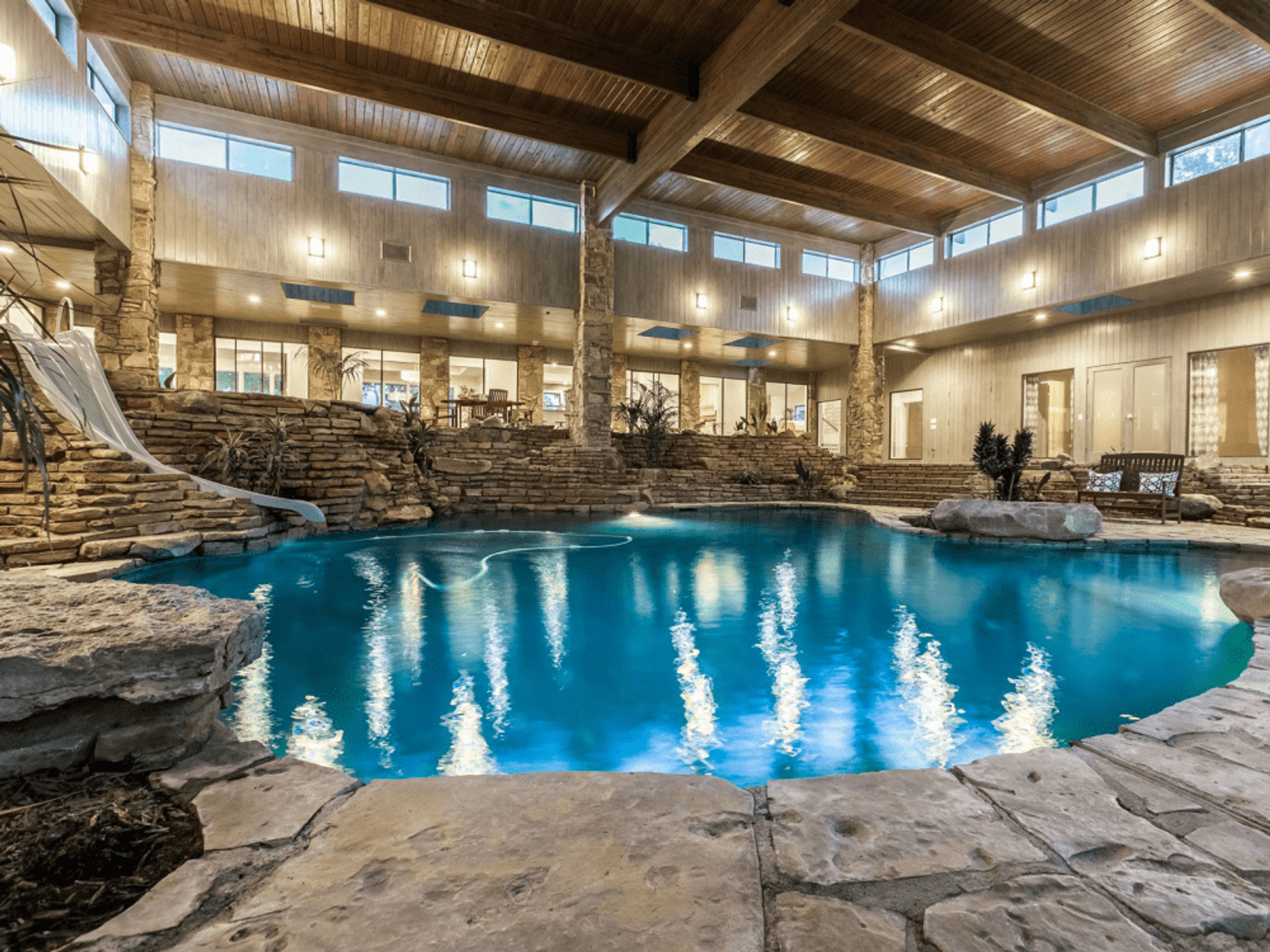 The massive home boasts an incredible indoor pool room.