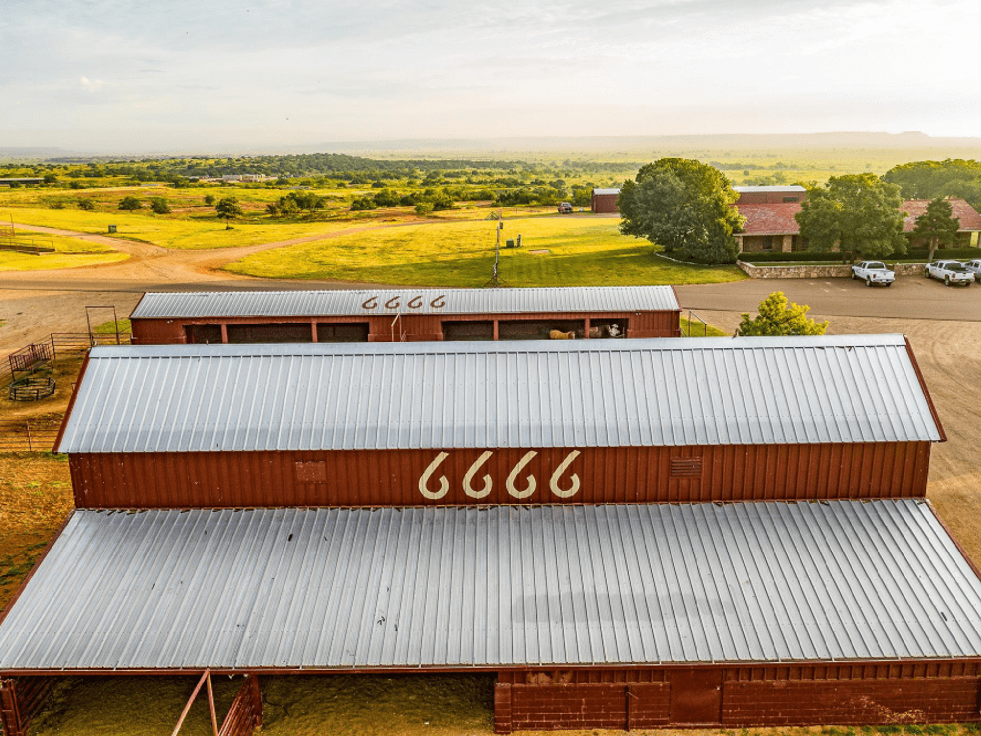 The property includes a 48,750-square-foot horse arena and several barns and stables.