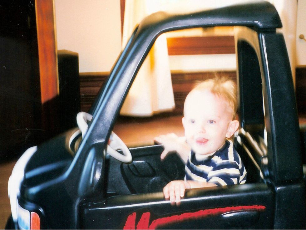 Toddler in his first car