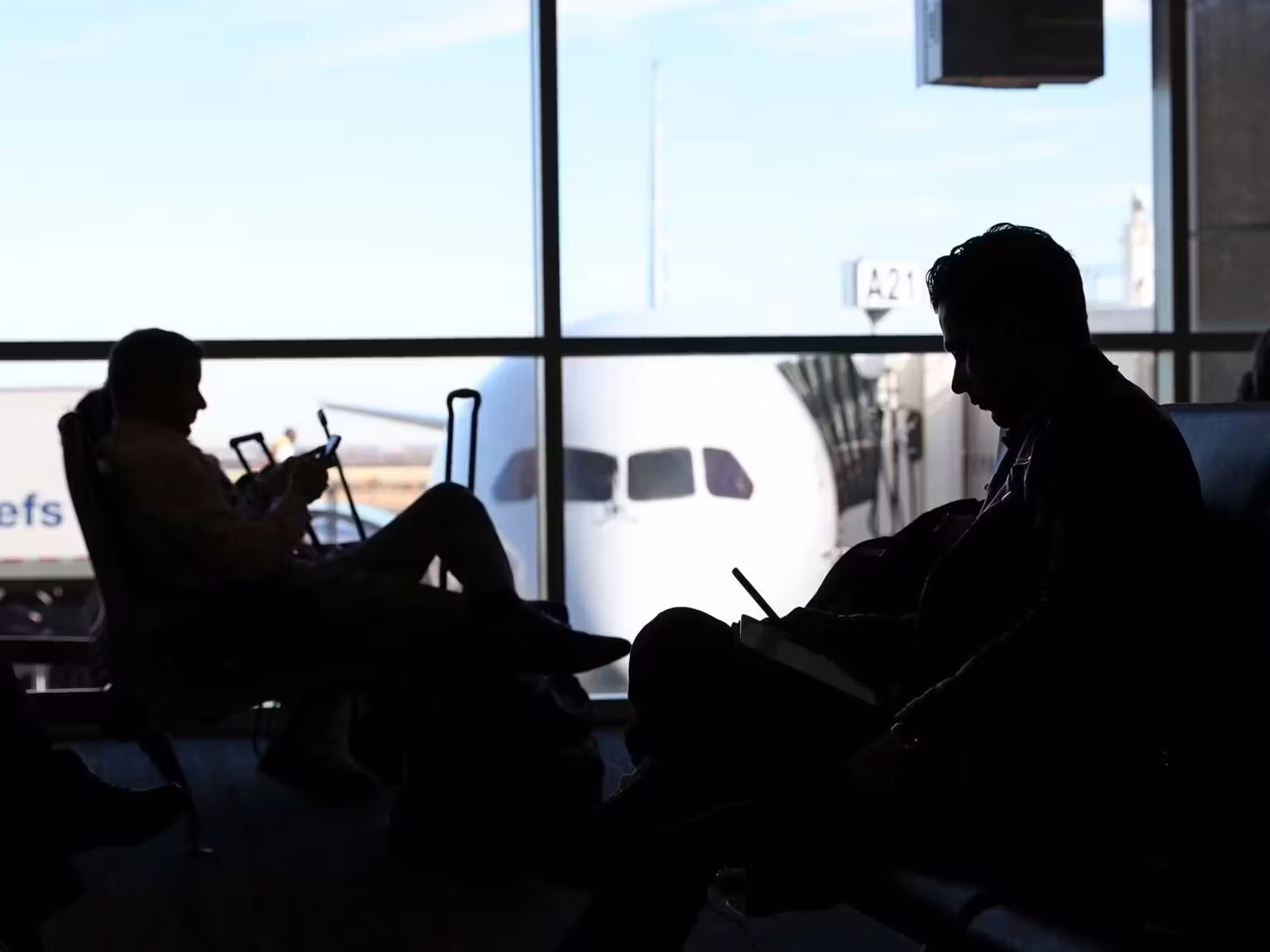 Travelers waiting for their flights at Dallas/Fort Worth International Airport