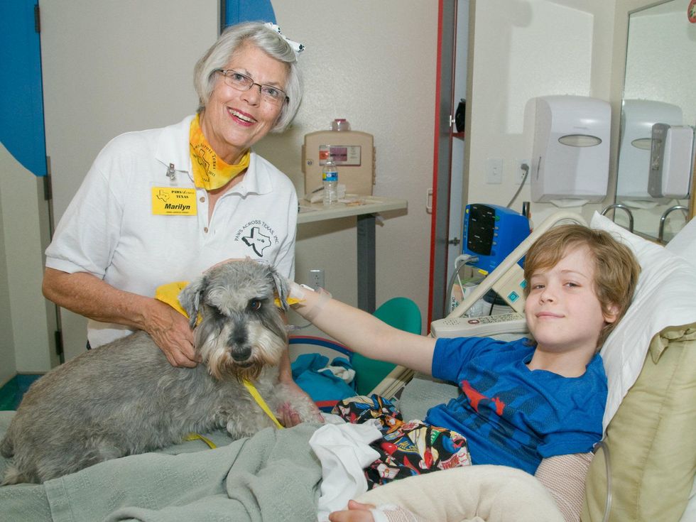 TSRHC volunteer Marilyn Nelson; Buddy, a Miniature Schnauzer; TSRHC patient Preston, age 9 of Dallas