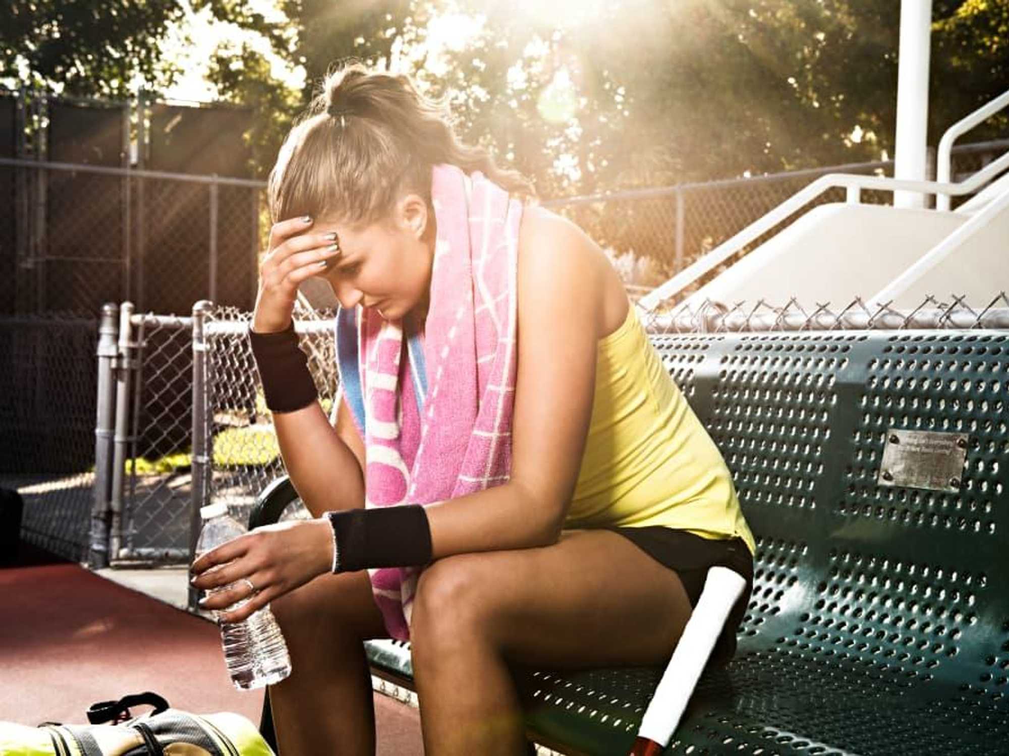 Woman frustrated about playing tennis