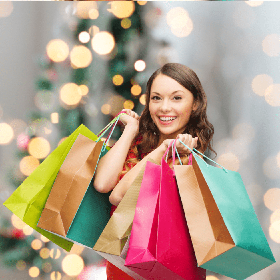 Woman holding bags, Christmas shopping