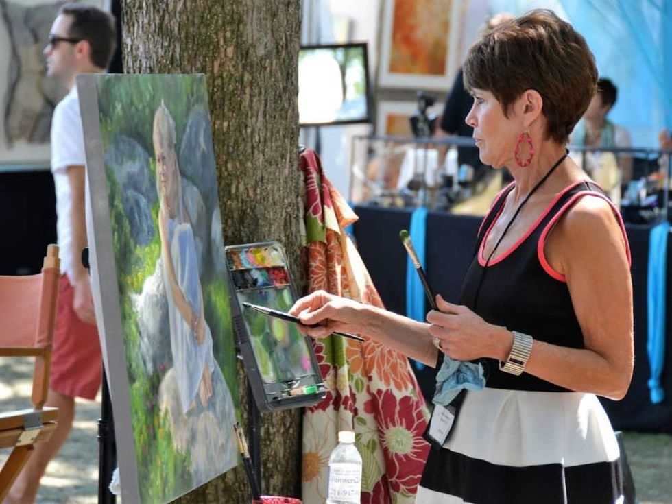Woman painting at Cottonwood Art Festival 2016
