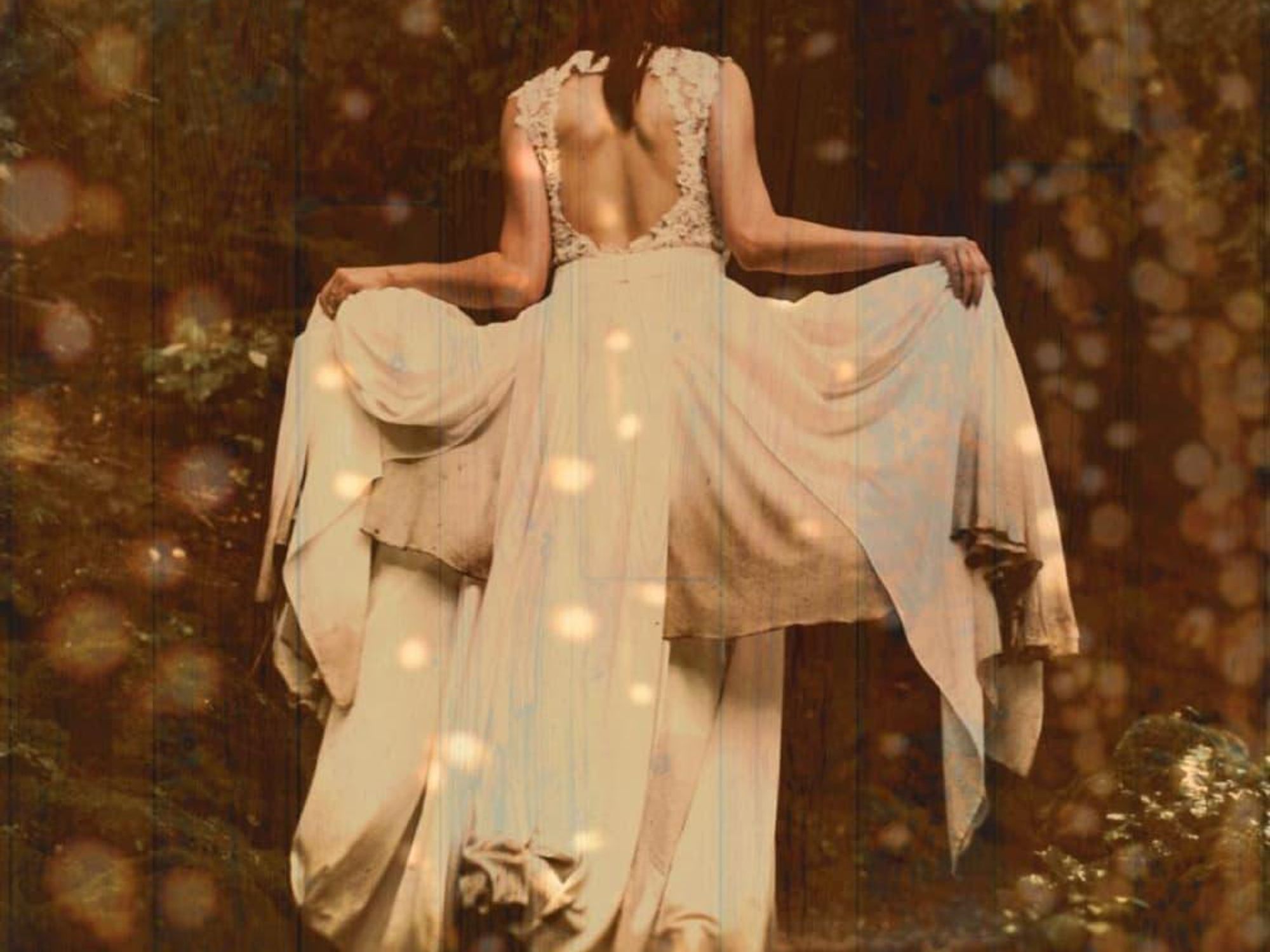 Woman walking away with fireflies