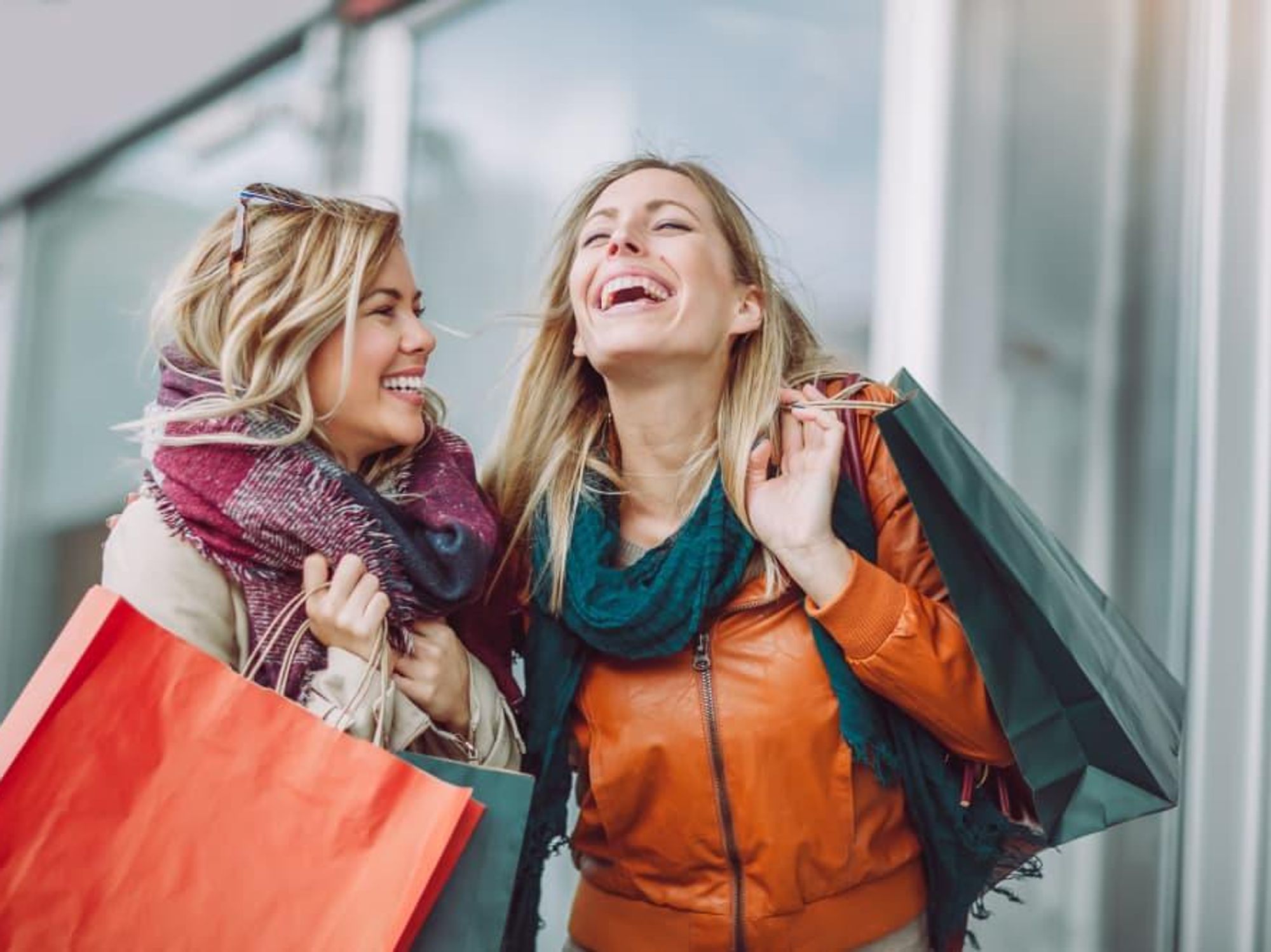 Women laughing and shopping