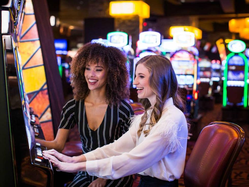 Women playing slot machines