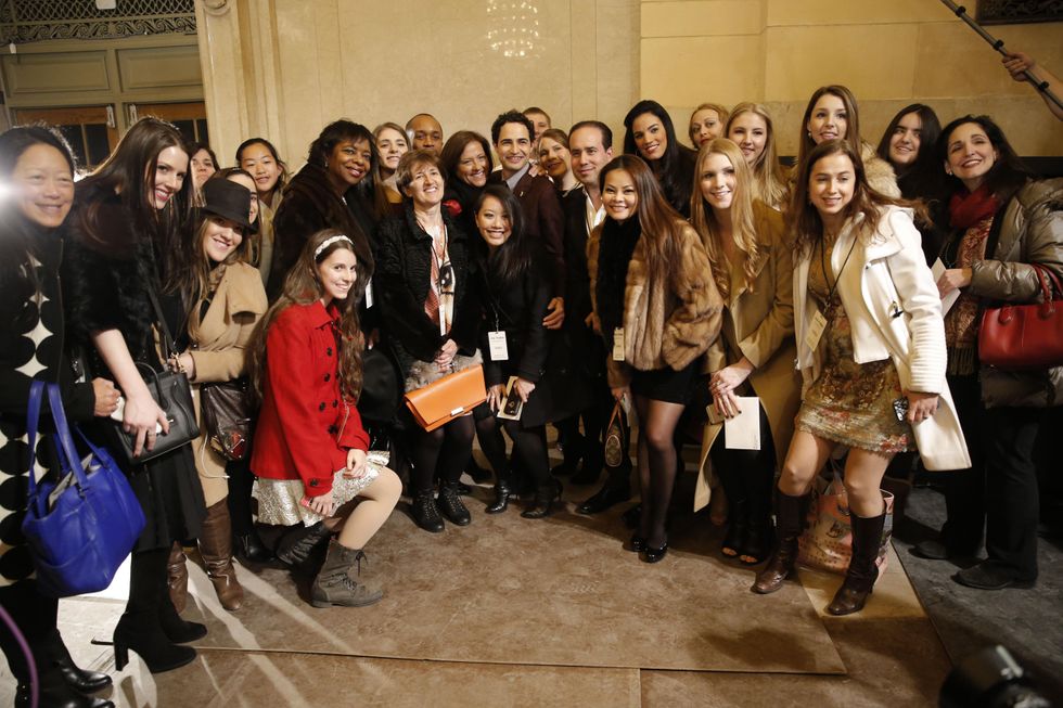 Zac Posen poses with American Express Platinum cardholders